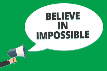 Handwriting text Believe In Impossible. Concept meaning You can do it everything is possible Work hard Message idea information text public loud speaker green plane background