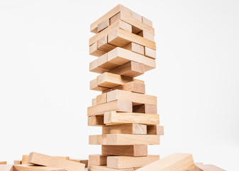 wood blocks tower game. planning, strategy and risk for business and finance. isolated background