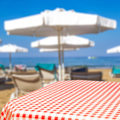 Desk of free space and beach background 