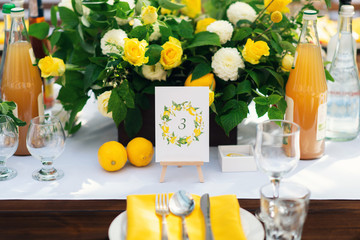 Elegant wedding table arrangement, floral decoration, restaurant. Wedding table setup. Wedding in the forest. Seat numbers. Lemon theme - 282847394