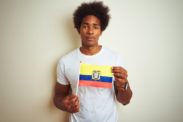 Afro american man holding Colombia Colombian flag standing over isolated white background with a confident expression on smart face thinking serious