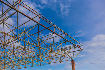 Metal old construction isolated at clear blue sky background. Horizontal color photography.