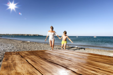 Desk of free space and beach background 