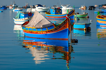 Fototapeta na wymiar Taditional eyed boats Luzzu in Marsaxlokk, Malta