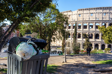 Accumulation of garbage in a park near the Coliseum. Italy, Rome pollution.