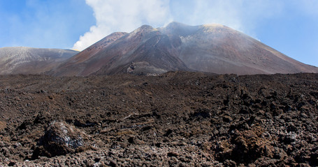 Close-up on lava black rocks of the Etna Mount. Landscape with volcano craters in Sicily, Italy....