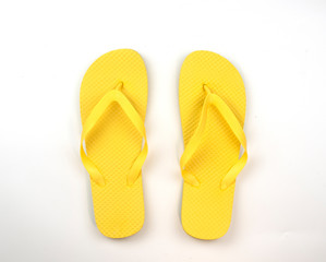 yellow flip flops isolated on white background. top view