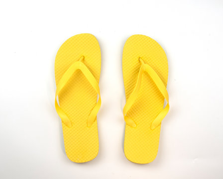 yellow flip flops isolated on white background. top view