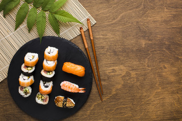Flat lay sushi arrangement with copy space