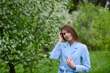 beautiful girl in a blooming Park