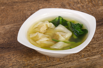 Asian traditional Wonton soup with herbs