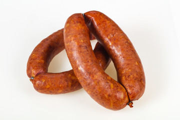 Tasty meat sausages over white background