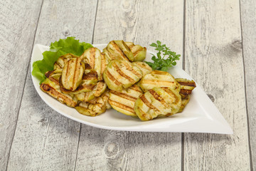 Grilled eggplant slices served basil