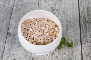 Raw oats in the bowl