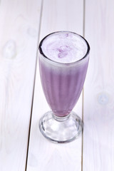 berry smoothie on the wooden background