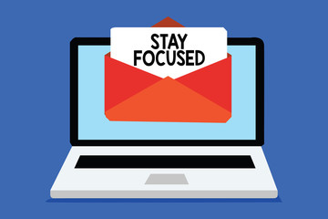 Word writing text Stay Focused. Business concept for Be attentive Concentrate Prioritize the task Avoid distractions Computer receiving email important message envelope with paper virtual