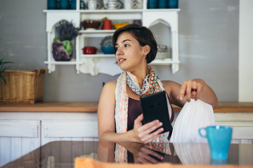 woman using tablet at her home