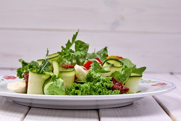 zucchini rolls with fresh salad