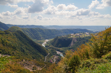 Beautiful view from the Enguri Dam of the scenic canyon, valley, river and village. Nature and travel. Georgia, Svaneti region, close to the border with Abkhazia.