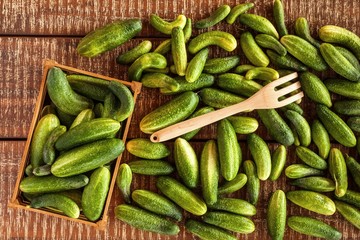 Vegetarian food. Cucumber sliced on the cutting board, salad ingredient, fresh cucumbers on a table. Cucumber harvest.