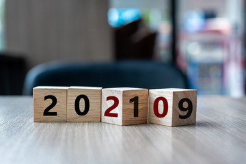 wooden cube with flip over block 2019 to 2020 word on table background. Resolution, strategy,...