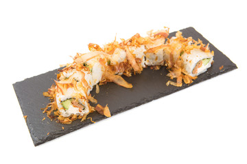 Sushi isolated on shale food board on white background Healthy and tasty food.