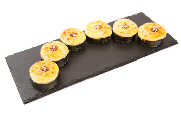 Fried Maki Sushi - Hot Roll with Salmon and Cream Cheese and Cucumber inside Healthy and tasty food.