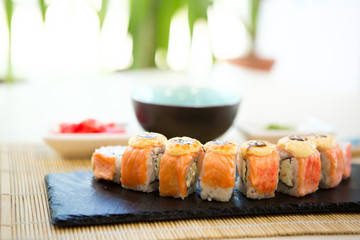 close up of sushi rolls on black tray Healthy and tasty food.