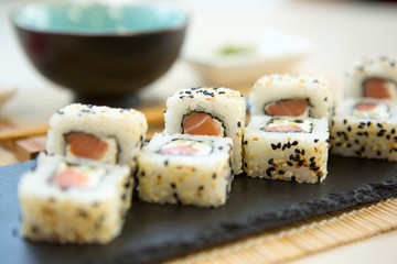 Philadelphia roll sushi with salmon, prawn, avocado, cream cheese. Sushi menu. Japanese food. Healthy and tasty food.