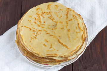 delicious fresh homemade pancakes on wooden background