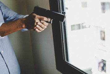 Man holding gunman concept.
