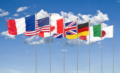 Silk waving G7 flags of countries of Group of Seven Canada, Germany, Italy, France, Japan, USA states, United Kingdom. Blue sky background. Big G7 in France 2019. 3D illustration.