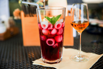 Two drinks on table, cognac and lemonade.