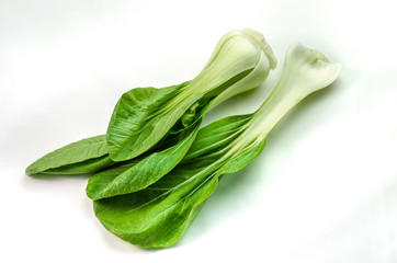 Pak choi a leafy green Chinese cabbage laying side by side to a broken off stem.