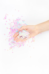 Pearl pastel confetti sparkles with woman hand