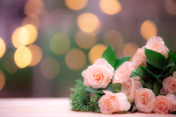 blur background rose flower on wooden table with gift box and copy space