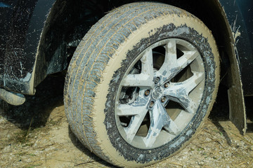 Off-road dirty car wheels. Swamp rubber. Jeep in the swamp. Trial competition.