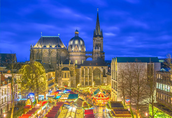 Aachen Cathedral with Christmas market during blue hour 