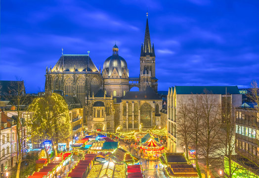 Aachen Cathedral with Christmas market during blue hour 