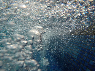 selective focus bubble under water in the pool.