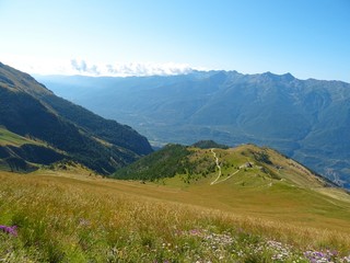 Nature, meadows and peaks that characterize the landscape of the Italian Alps in Val di Susa, near...