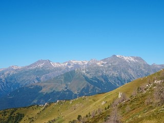Fototapeta premium Nature, meadows and peaks that characterize the landscape of the Italian Alps in Val di Susa, near the town of 