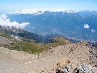 Nature, meadows and peaks that characterize the landscape of the Italian Alps in Val di Susa, near...