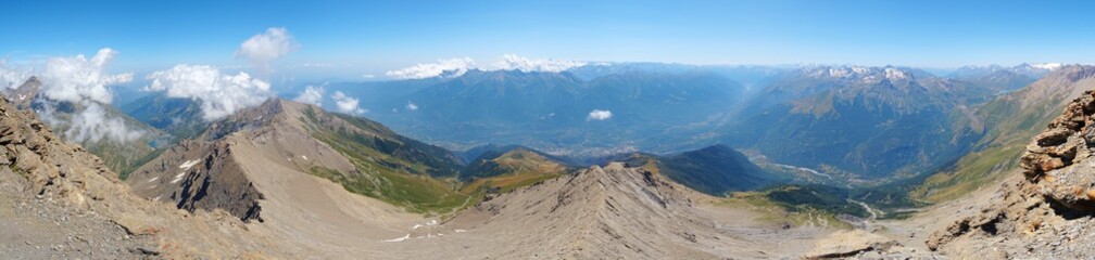 Nature, meadows and peaks that characterize the landscape of the Italian Alps in Val di Susa, near the village of "Susa", Piedmont - August 2019.