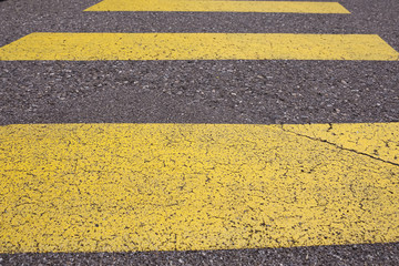 Crosswalk yellow lines on the road. zebra yellow pedestrian crossing