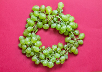  grapes on a raspberry background circle summer