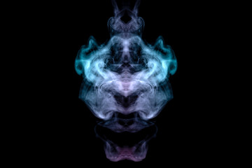 A mystical image of a ghost head or an alien from green and purple smoke. Print for clothes.