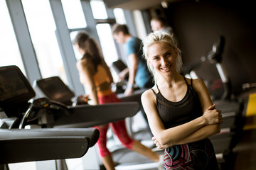 Portrait of young woman standing in the gym