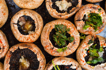Baked mushrooms, roasted with fresh coriander and garlic. Vegan food. Stuffed champignon.