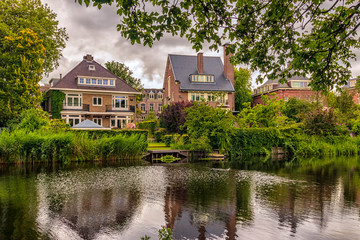 Fototapeta na wymiar Typical Dutch village by the lake